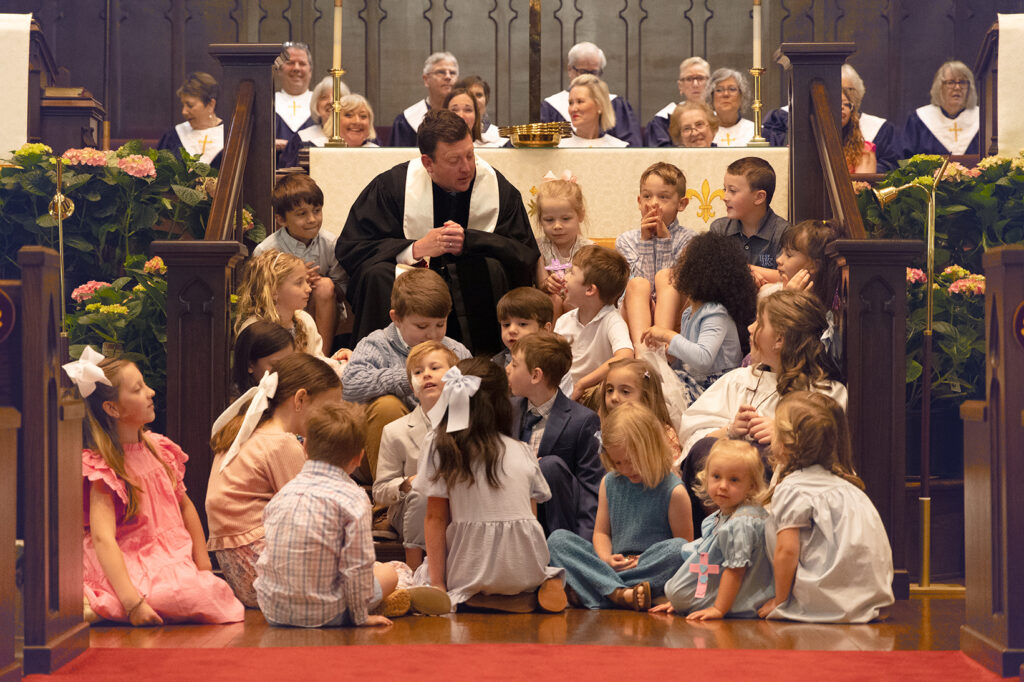 Reverend Justin Ramer with the congregation's children